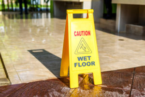 slip and fall sign marking wet floor