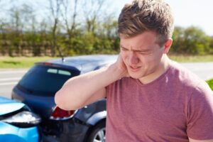 Driver suffering whiplash after a car accident