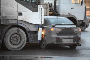 car crashed by truck accident