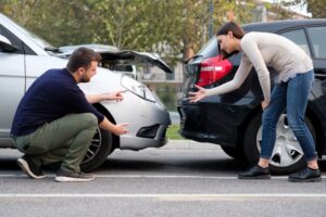 People arguing after car crash